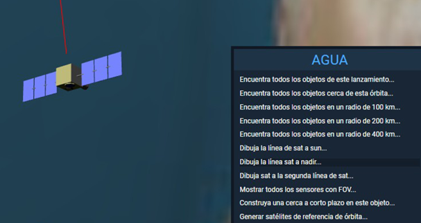 Captura de pantalla que muestra un modelo tridimensional de un satélite en órbita sobre la superficie terrestre. El satélite tiene un cuerpo central cúbico color beige y dos paneles solares azules extendidos a los lados. Desde su parte inferior desciende una línea roja que indica la trayectoria hacia la Tierra.
A la derecha, una ventana de menú titulada “AGUA” presenta una lista de opciones en español, entre ellas: “Encuentra todos los objetos cerca de esta órbita…”, “Dibuja la línea sat a nadir…” y “Mostrar todos los sensores con FOV…”.
La imagen representa una interfaz de software para la visualización o control de satélites.